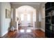 Open foyer with hardwood floors and arched entryways showcasing elegant design at 11105 5Th E St, Treasure Island, FL 33706