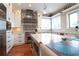 Open kitchen has stainless appliances, a center island, and ample counter space at 11105 5Th E St, Treasure Island, FL 33706