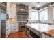 Updated kitchen featuring stainless steel appliances, a center island and designer lighting at 11105 5Th E St, Treasure Island, FL 33706
