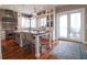 Bright kitchen with island, breakfast bar, stainless steel appliances and hardwood flooring at 11105 5Th E St, Treasure Island, FL 33706