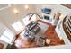 Spacious living room with a fireplace, hardwood floors, comfortable sofas, and plenty of natural light at 11105 5Th E St, Treasure Island, FL 33706