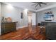 Open living room featuring hardwood floors, detailed molding, and a large flat-screen TV at 11105 5Th E St, Treasure Island, FL 33706