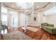 Elegant interior showcasing a white spiral staircase, hardwood floors, and stylish furnishings at 11105 5Th E St, Treasure Island, FL 33706