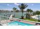 Balcony view of pool and dock showcasing waterfront paradise and outdoor living at 11105 5Th E St, Treasure Island, FL 33706