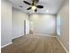Bedroom featuring neutral walls, carpet, ceiling fan, and a window with blinds at 11414 Weston Course Loop, Riverview, FL 33579