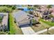 Inviting single-Gathering home featuring a two-car garage, and well-maintained lawn and landscaping at 11414 Weston Course Loop, Riverview, FL 33579