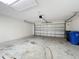 Spacious two-car garage with a clean, well-lit interior and automatic door at 11414 Weston Course Loop, Riverview, FL 33579
