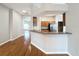 Inviting living space with hardwood floors and breakfast bar at 11414 Weston Course Loop, Riverview, FL 33579