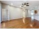 Spacious living room with hardwood floors, ceiling fan, and view to other rooms at 11414 Weston Course Loop, Riverview, FL 33579