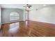 Expansive living area showcasing gleaming hardwood floors and ample space at 11414 Weston Course Loop, Riverview, FL 33579