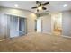 Large main bedroom featuring vaulted ceilings, ceiling fan, and an ensuite bath at 11414 Weston Course Loop, Riverview, FL 33579