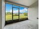 Screened patio offers serene views of the lush backyard, tranquil pond, and blue sky at 11414 Weston Course Loop, Riverview, FL 33579