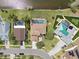 Aerial view of homes featuring screened in pools, backyard entertaining space, and well-manicured lawns at 11519 Glenmont Dr, Tampa, FL 33635