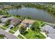 Waterfront home with lush green landscaping, and beautiful lake views at 11519 Glenmont Dr, Tampa, FL 33635