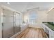 Luxurious bathroom featuring a glass shower, soaking tub and vanity at 11519 Glenmont Dr, Tampa, FL 33635