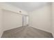 Neutral bedroom showcasing plush carpet and a walk-in closet at 11519 Glenmont Dr, Tampa, FL 33635