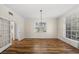 Spacious dining room with wood floors, chandelier, and plenty of natural light at 11519 Glenmont Dr, Tampa, FL 33635