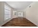 Light-filled room with wood floors, large windows, and neutral wall color at 11519 Glenmont Dr, Tampa, FL 33635
