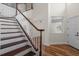 Elegant staircase with wood treads and white risers, leading to the upper level at 11519 Glenmont Dr, Tampa, FL 33635