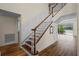 Elegant staircase with wood and white accents, leading to the upper level at 11519 Glenmont Dr, Tampa, FL 33635