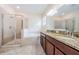 Elegant bathroom with a double vanity, granite countertops, a glass-enclosed shower, and a soaking tub at 1155 Lawnview Ter, New Port Richey, FL 34655