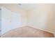 Bedroom features neutral carpet and large closet at 1155 Lawnview Ter, New Port Richey, FL 34655