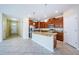 Modern kitchen with granite countertops, stainless steel appliances, and a center island at 1155 Lawnview Ter, New Port Richey, FL 34655