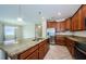 Well-appointed kitchen featuring granite countertops, stainless steel appliances, and a central island at 1155 Lawnview Ter, New Port Richey, FL 34655