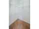 Spacious walk-in closet featuring neutral carpet and white-wire shelving at 1155 Lawnview Ter, New Port Richey, FL 34655