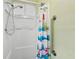 Bathroom featuring a shower with a handheld shower head, and a safety handle at 11705 Ibis Ln, Port Richey, FL 34668