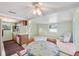 Cozy dining area with a ceiling fan, and seamless flow into the living space at 11705 Ibis Ln, Port Richey, FL 34668