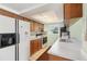 Kitchen featuring white appliances, and great natural light at 11705 Ibis Ln, Port Richey, FL 34668