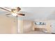 Living room with neutral walls, carpet, window, door to patio, and a ceiling fan with a light at 11705 Ibis Ln, Port Richey, FL 34668