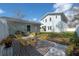 Charming backyard featuring yellow chairs, black and white mat, and lush greenery at 1550 48Th N Ave, St Petersburg, FL 33703