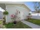 Quaint backyard with a lovely garden and charming curb appeal at 1550 48Th N Ave, St Petersburg, FL 33703