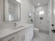 Bright bathroom with white marble floors, a sleek vanity, and a stylish glass-enclosed shower at 1550 48Th N Ave, St Petersburg, FL 33703