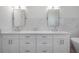 Contemporary bathroom with dual sinks, white countertops, and stylish fixtures at 1550 48Th N Ave, St Petersburg, FL 33703