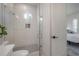 Modern bathroom featuring a glass-enclosed shower, white subway tiles, and sleek fixtures at 1550 48Th N Ave, St Petersburg, FL 33703