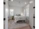 Serene bedroom with neutral tones, hardwood floors, a comfortable bed, and ample natural light at 1550 48Th N Ave, St Petersburg, FL 33703
