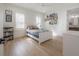 Bright bedroom with natural light and warm hardwood floors, perfect for relaxing at 1550 48Th N Ave, St Petersburg, FL 33703