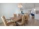 Dining room with a rustic wooden table, leather chairs, and a decorative chandelier at 1550 48Th N Ave, St Petersburg, FL 33703