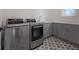 Well-equipped laundry room with modern appliances, countertops, and stylish tile at 1550 48Th N Ave, St Petersburg, FL 33703