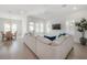 Bright living room featuring a large sectional sofa and hardwood floors at 1550 48Th N Ave, St Petersburg, FL 33703