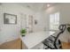 Modern office with hardwood floors, a large white desk, shuttered windows, and sleek furnishings at 1550 48Th N Ave, St Petersburg, FL 33703