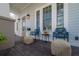 Charming covered porch featuring comfortable seating and stylish decor, perfect for relaxing outdoors at 1550 48Th N Ave, St Petersburg, FL 33703