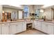 Spacious bathroom with double vanity, granite countertop, and lots of cabinetry at 1725 Trailhead Ln, Zephyrhills, FL 33541