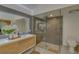 Bathroom featuring glass shower, toilet, and modern wood cabinet vanity at 1810 Pine Hill Dr, Safety Harbor, FL 34695