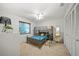 Bright bedroom featuring a bunk bed with gray frame, complementary decor, and a ceiling fan at 1810 Pine Hill Dr, Safety Harbor, FL 34695