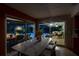 The dining area boasts ample natural light and direct access to the screened-in outdoor seating and pool area at 1810 Pine Hill Dr, Safety Harbor, FL 34695