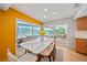 Dining room with a view of the pool and outdoor dining area at 1810 Pine Hill Dr, Safety Harbor, FL 34695